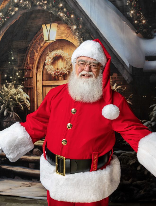 Santa Roger with arms wide, welcoming